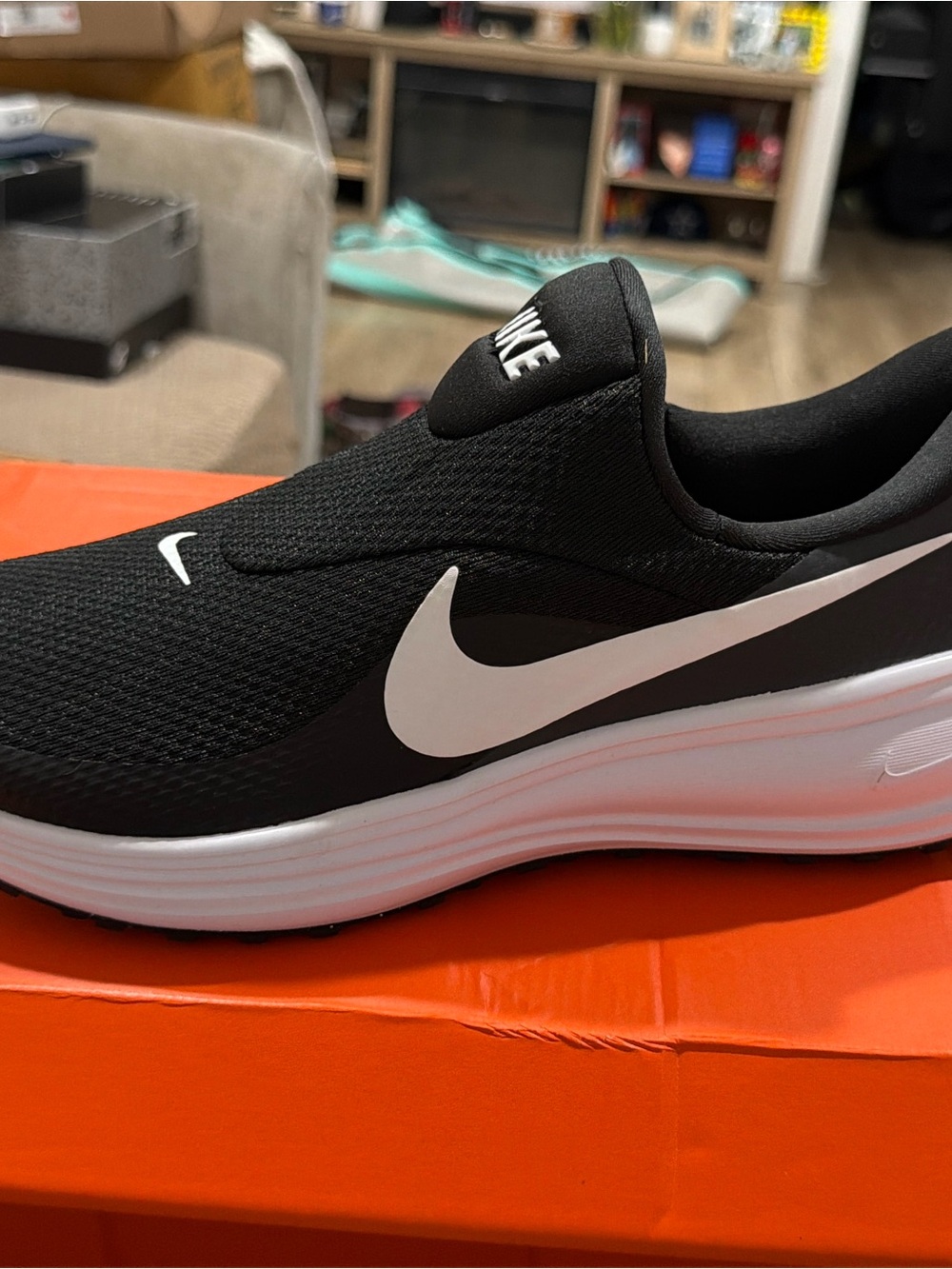 Nike Men’s Black and White Slip-On Running Sneakers